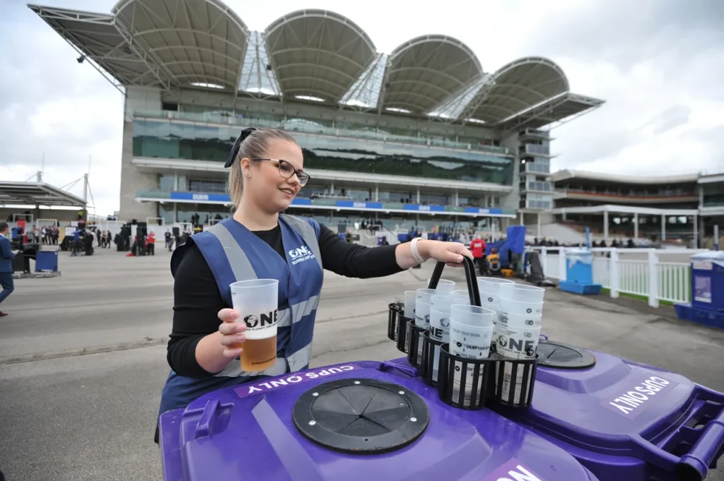 person collecting reusable cups on site