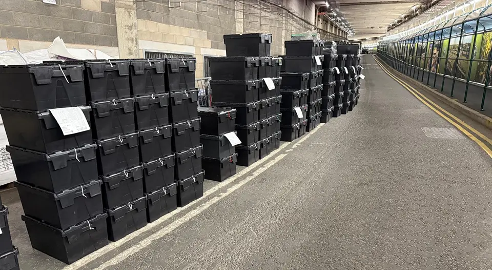 tote boxes of reusable cups lined up